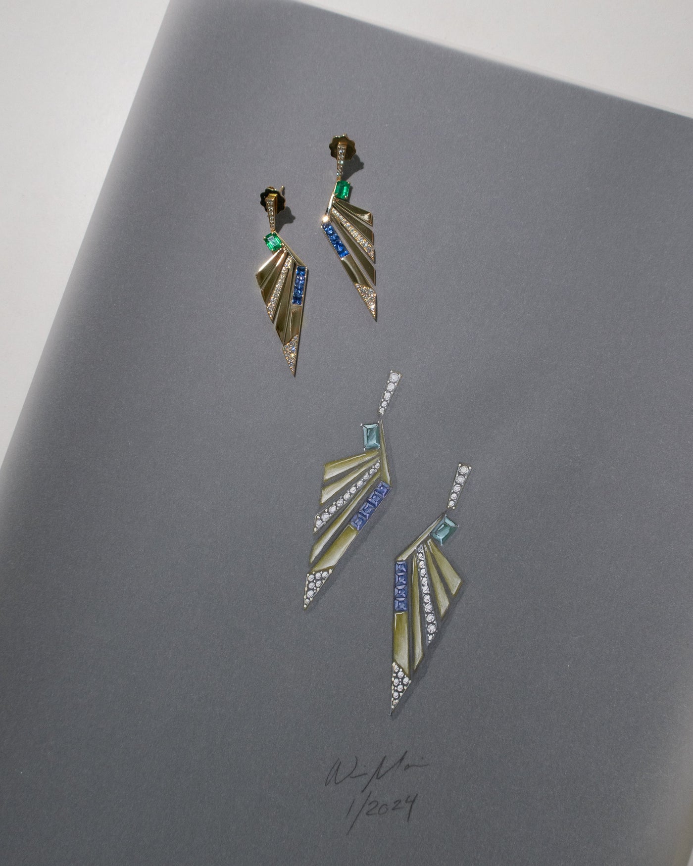 Geometric earrings on a gray surface jewelry design