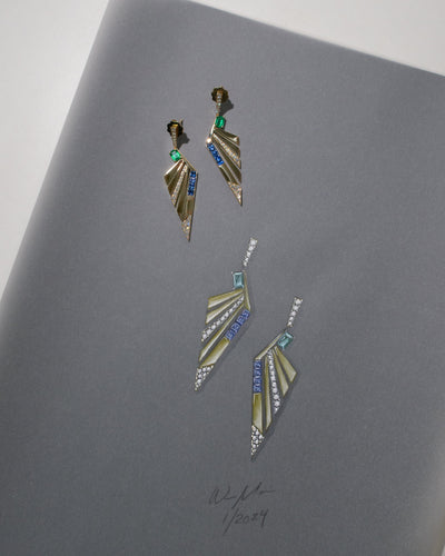 Geometric earrings on a gray surface jewelry design